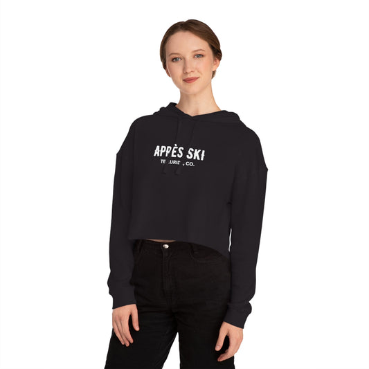 Black cropped hooded sweatshirt with white lettering saying "Après Ski" and "Telluride, CO." The sweatshirt is a stylish and comfortable way to show your love of skiing and the Telluride Ski Resort. The text is a reference to the French tradition of après-ski, which is a time to socialize and celebrate after a day on the slopes. 