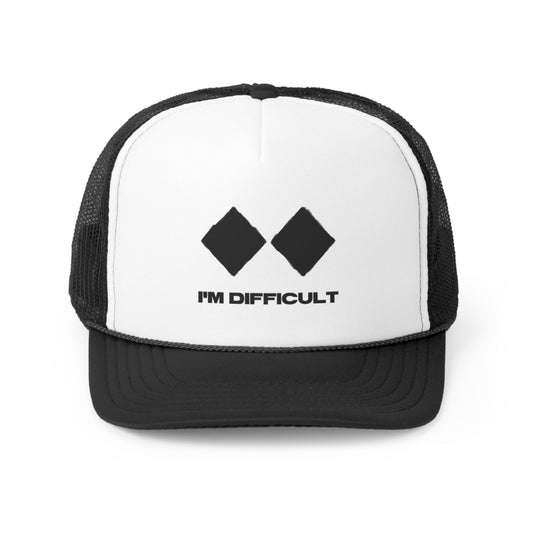 Black trucker hat with white label and black lettering saying "I'm Difficult" and two double diamond ski signs. It is perfect for keeping the sun out of your face while you're skiing or snowboarding.  The two double diamond ski signs are a reference to the most challenging ski runs at Telluride Ski Resort, making this hat a great way to show your support for the resort and the snowboard and ski lifestyle.